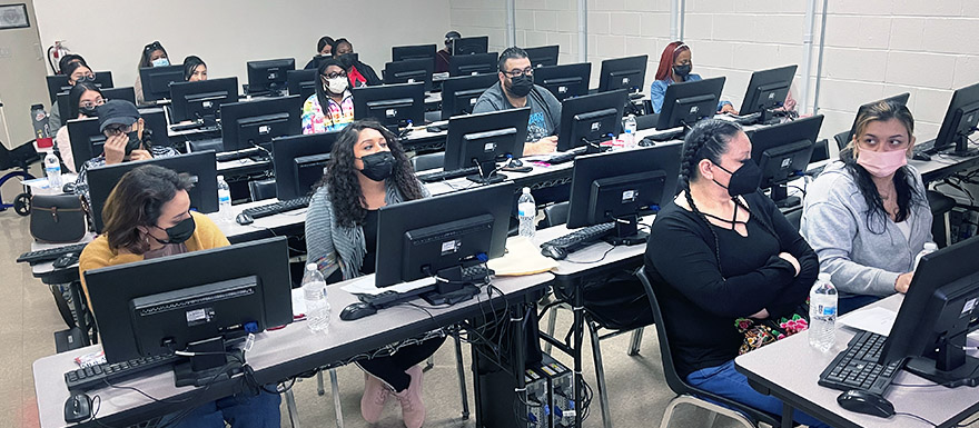 Students at the LVN Open House Event in a computer lab.