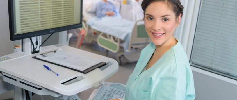 Medical Assistant using computer.